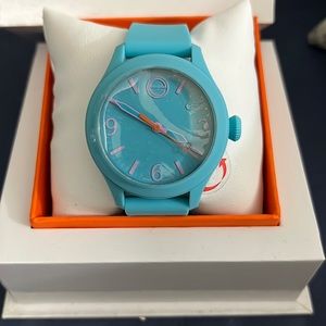 NIB dark baby blue Movado watch.
